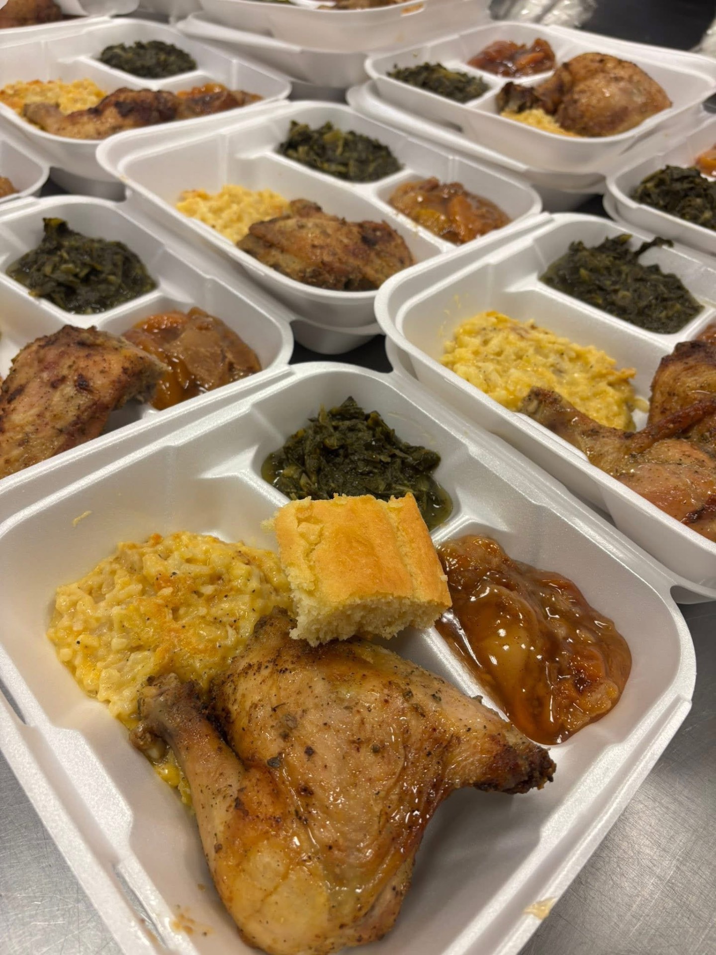 Boxed plate lunches with roasted chicken and cornbread