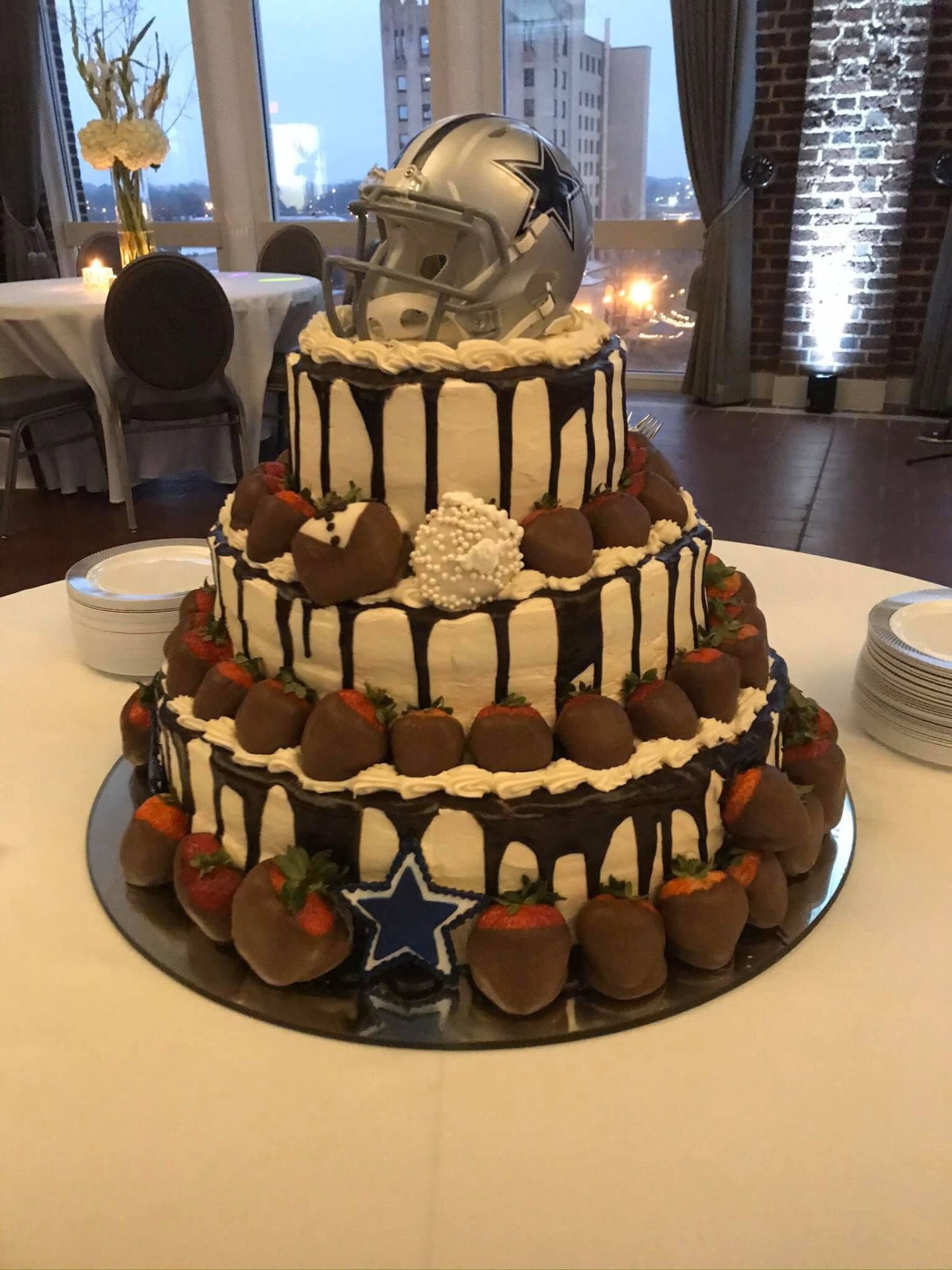 Three-tier Dallas Cowboys themed chocolate drip cake